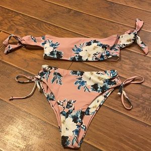 Two piece bathing suit. Never worn. Size small.
